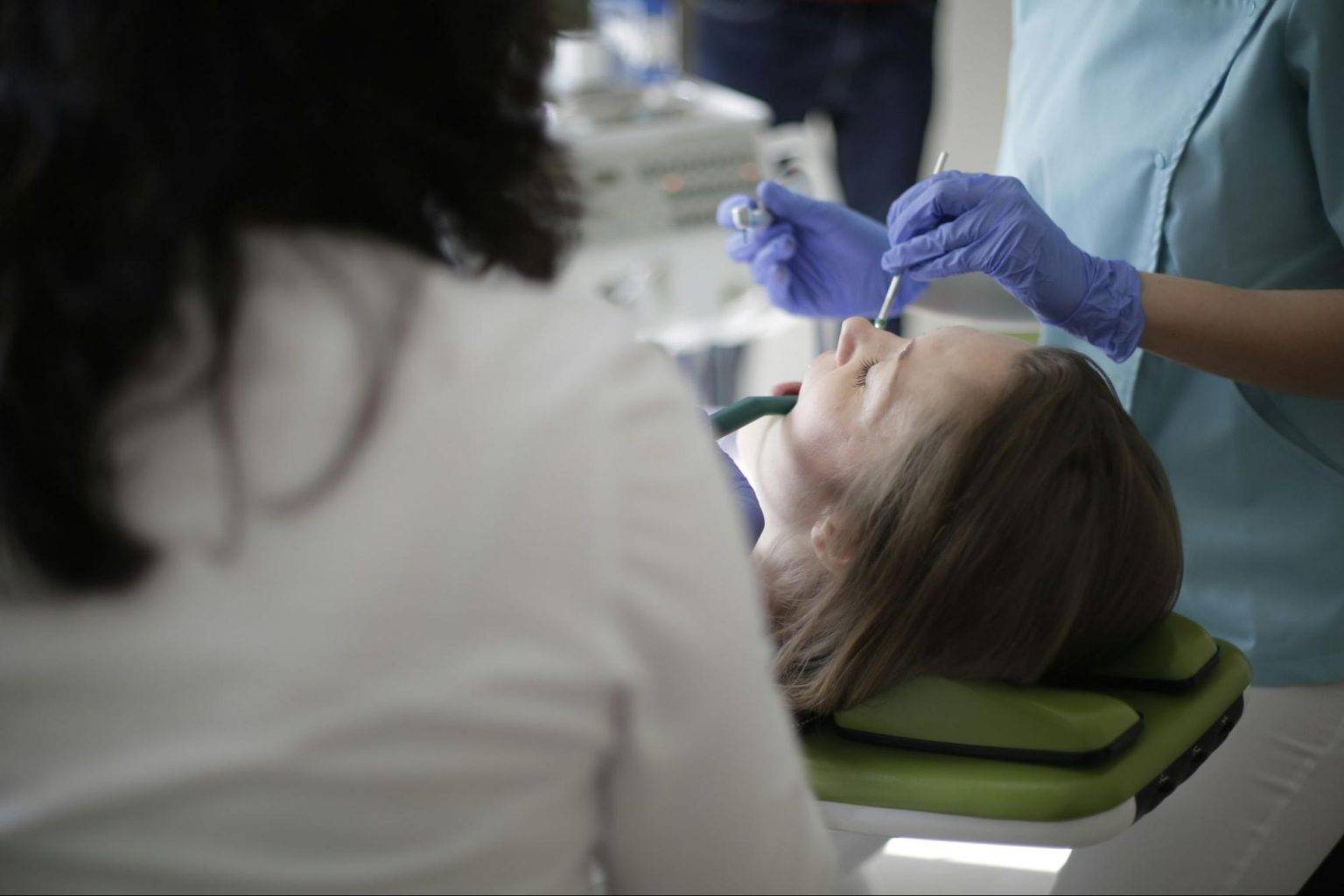 Doctor operating female patient on operation threatre